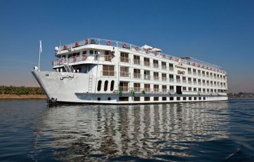 The Steigenberger Legacy Nile Cruise ship sailing on the river.