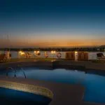 The swimming pool on the MS Steigenberger Royale at sunset.
