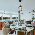 The elegant and modern dining area aboard the MS Tamr Henna Nile Cruise offers stylish marble tables plush velvet chairs and panoramic views of the Nile River as you sail