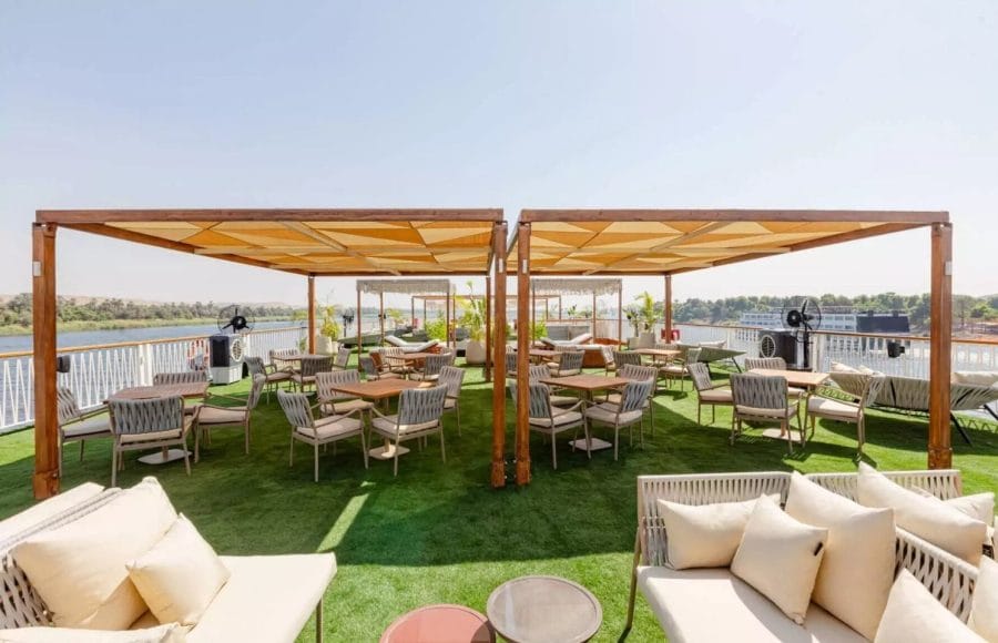 Enjoy the open-air ambiance of the beautifully landscaped Sun Deck Restaurant aboard the MS Tamr Henna Nile Cruise offering comfortable dining views of the Nile River