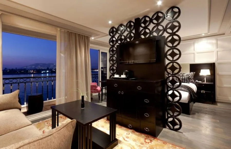 A luxurious suite on the Mayfair Nile Cruise with a balcony.
