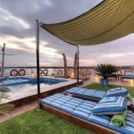 The sun deck on the Mayfair Nile Cruise with a pool and lounge chairs.