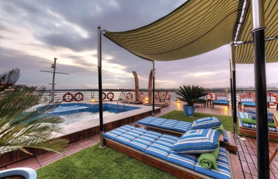 The sun deck on the Mayfair Nile Cruise with a pool and lounge chairs.
