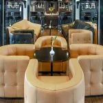 The lounge on the Moondance Nile Cruise features comfortable leather seating, a stylish bar, and elegant lighting for relaxation.