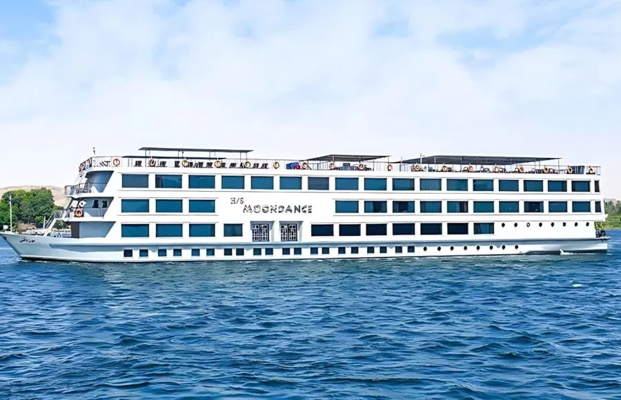 H/S Moondance Nile cruise ship sailing on the Nile River under a clear sky, offering a luxurious and unforgettable travel experience.