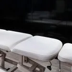 A tranquil and well-lit spa room on the H/S Moondance Nile cruise, featuring a comfortable massage bed, soft lighting, and a serene ambiance perfect for relaxation.