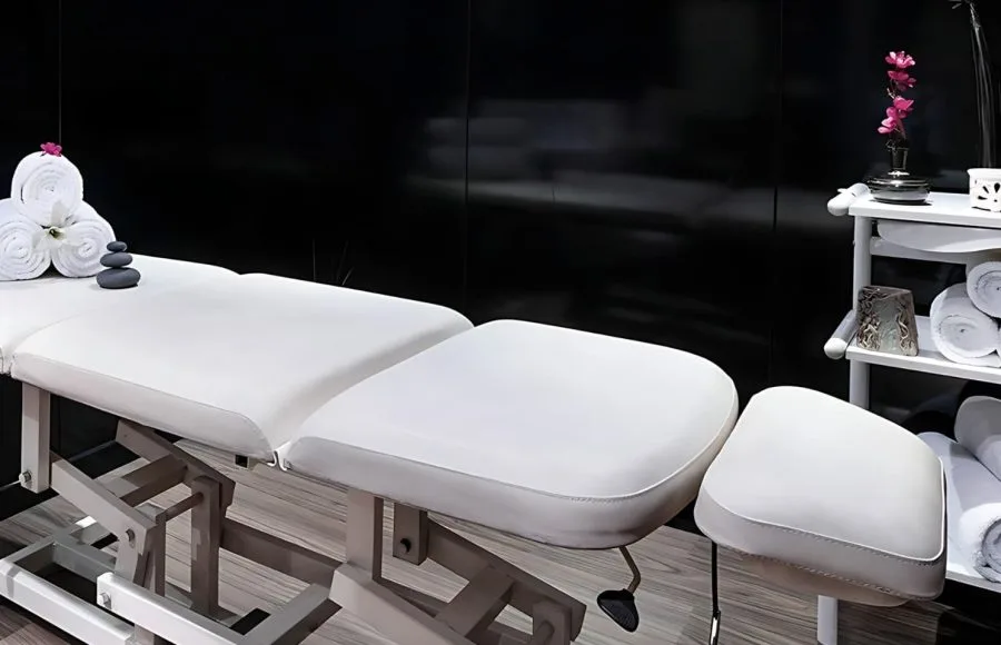 A tranquil and well-lit spa room on the H/S Moondance Nile cruise, featuring a comfortable massage bed, soft lighting, and a serene ambiance perfect for relaxation.