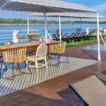 Movenpick MS Sunray sun deck with wicker dining and lounge chairs offering beautiful views during the Nile Cruise.