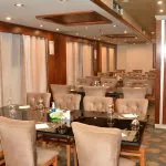 The main restaurant of the Blue Shadow 4 with elegant chairs and tables.