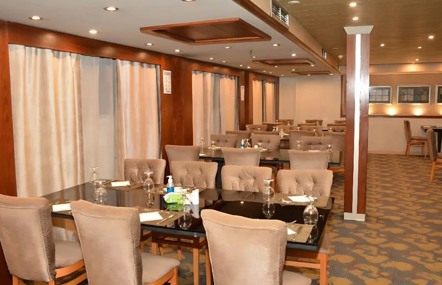 The main restaurant of the Blue Shadow 4 with elegant chairs and tables.