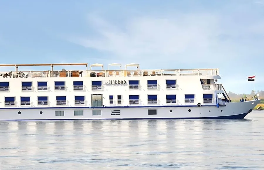 The elegant H/S Sindbad Nile Cruise sails smoothly along the majestic river, a symbol of luxury travel and adventure in Egypt.