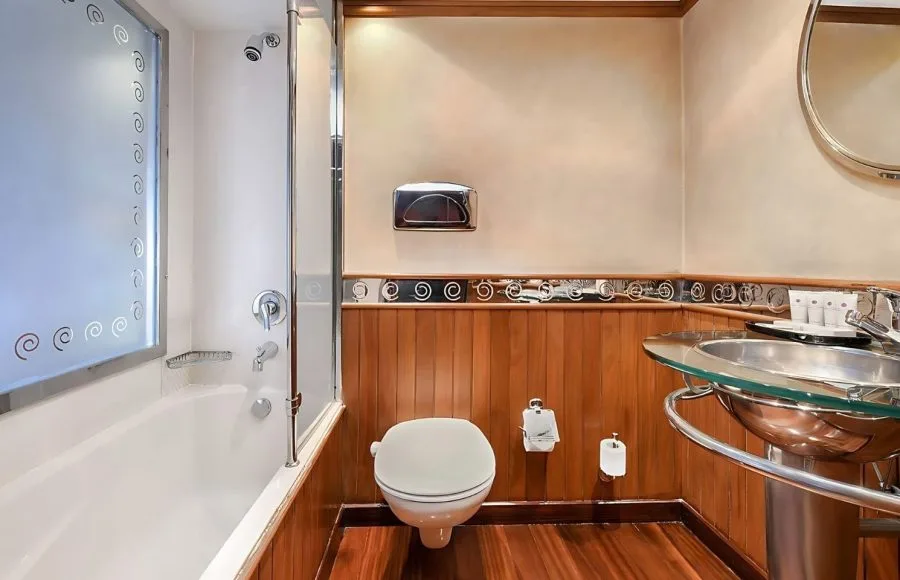 Luxurious bathroom on the Kon Tiki Nile cruise with a bathtub shower toilet and elegant sink