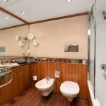 Kon Tiki Nile cruise suite bathroom with a bidet mirror and elegant sink