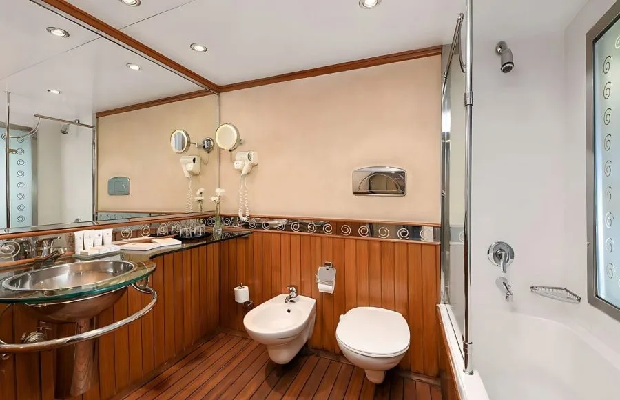 Kon Tiki Nile cruise suite bathroom with a bidet mirror and elegant sink