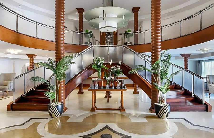Elegant lobby of the Kon Tiki Nile cruise with potted plants and a reception area.