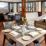 The elegant dining area on the Kon Tiki Nile cruise with beautifully set tables and large windows offering river views.