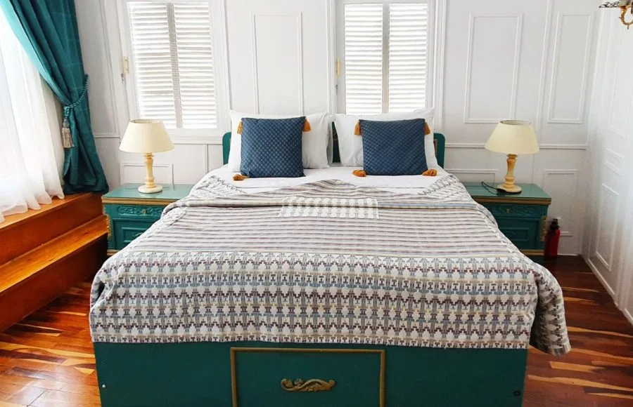 A comfortable suite bedroom on a Nile cruise boat.