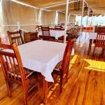 Sun deck dining area on the Abundance Dahabiya Nile cruise boat.