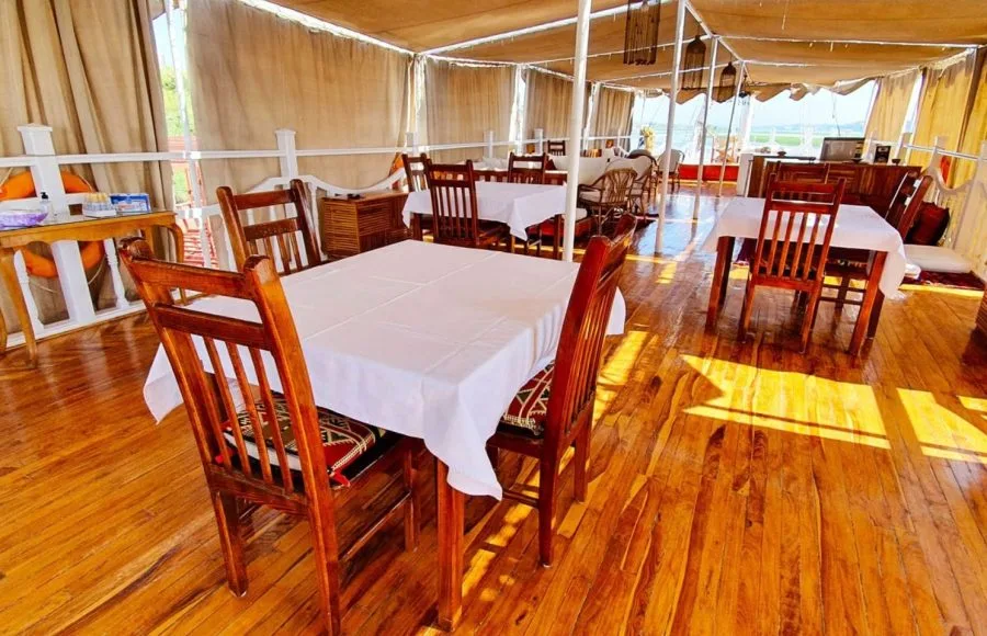Sun deck dining area on the Abundance Dahabiya Nile cruise boat.