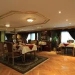 A luxurious dining room on the Dahabiya Rois Nile Cruise.
