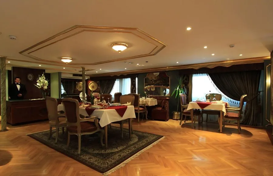A luxurious dining room on the Dahabiya Rois Nile Cruise.