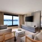 A luxury hotel room suite on a Nile cruise ship with a river view.