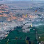 Hot-Air-Balloon-Contemplating-The-Striking-Contrast-Between-The-Lush-Nile-Valley-And-The-Vast