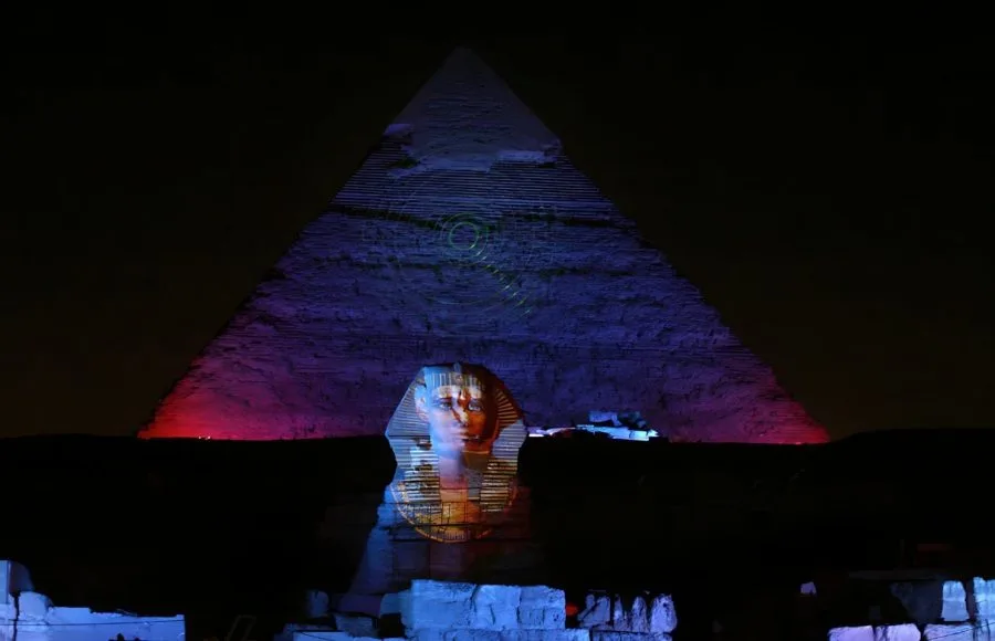 A Pharaoh’s face and jewelry projected onto the Great Sphinx using digital mapping.