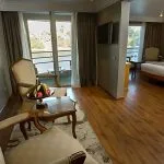 A cozy twin bed cabin on the MS A Sara, featuring comfortable beds and a window with a view of the Nile.