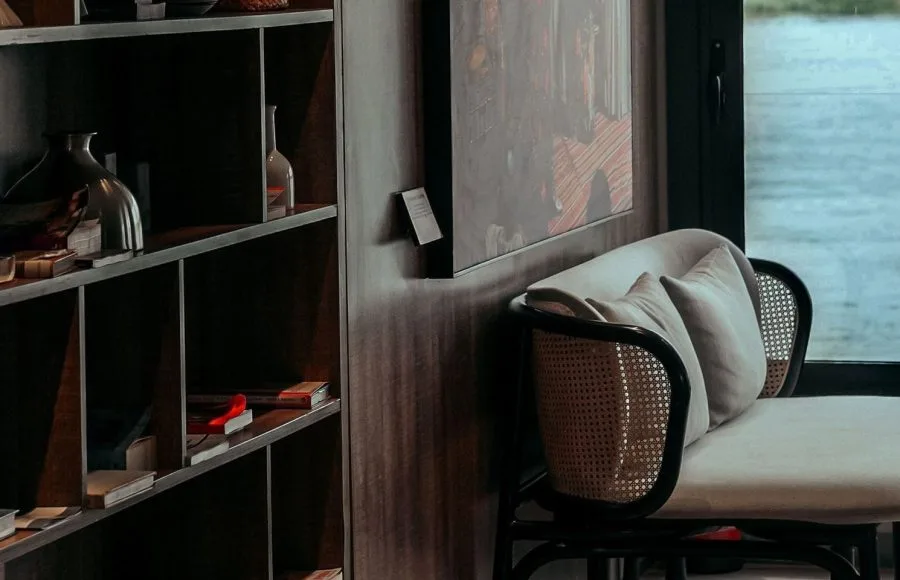 A quiet onboard library and reading lounge area with a book collection.