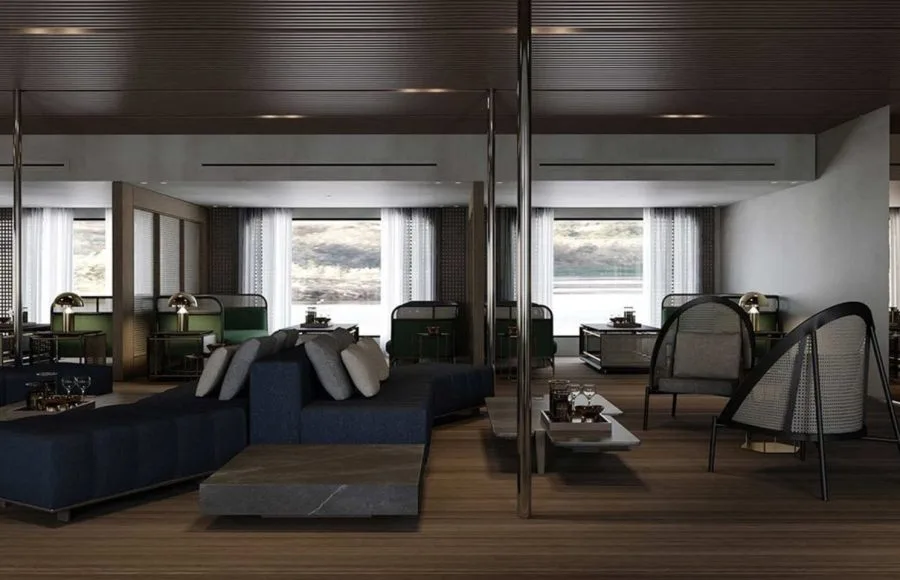 Modern luxury yacht or suite interior with seating and a panoramic window view.