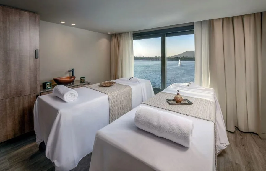 A spa treatment room on a luxury Nile cruise ship with a river view.