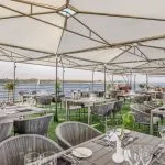 Sundeck dining area on the Historia Nile Cruise ship with views of the river.