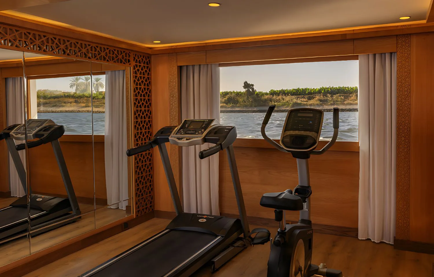 Gymnasium on the Jaz Senator Nile Cruise with a view of the Nile River.