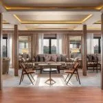 The elegant and spacious lounge area on the Jaz Viceroy Nile Cruise, with comfortable seating arrangements and large windows.