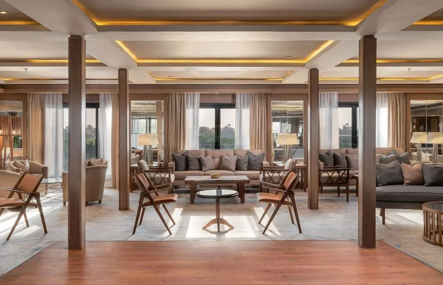 The elegant and spacious lounge area on the Jaz Viceroy Nile Cruise, with comfortable seating arrangements and large windows.