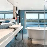 Contemporary bathroom with a standalone tub on the Oberoi Philae Luxury Nile Cruise.