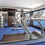 Modern gymnasium with exercise equipment on the Oberoi Philae Luxury Nile Cruise.