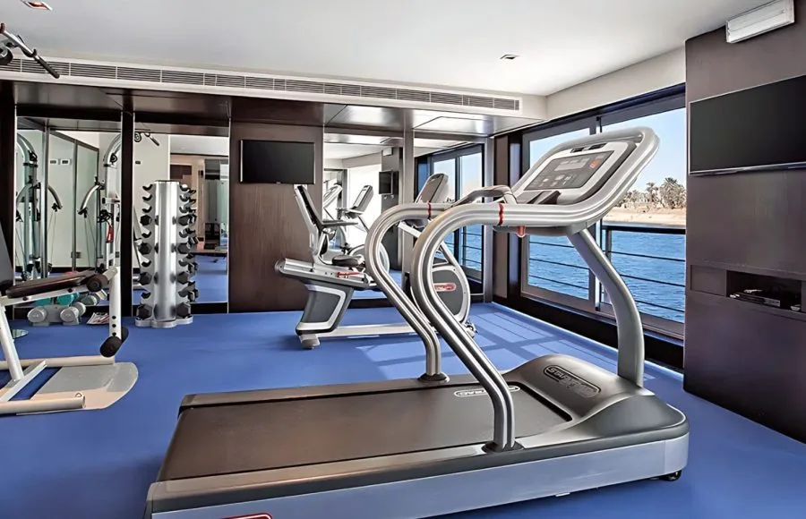 Modern gymnasium with exercise equipment on the Oberoi Philae Luxury Nile Cruise.
