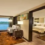 Spacious, luxurious suite with separate living areas, and a large window on the Oberoi Philae.