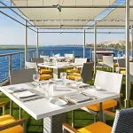 Covered outdoor restaurant on the sun deck on the Oberoi Philae Luxury Nile Cruise.