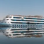 The sleek exterior of the Oberoi Zahra Nile Cruise ship on the Nile River.