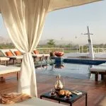 Sun deck and pool with white cabanas on the MS Sanctuary Nile Adventurer.