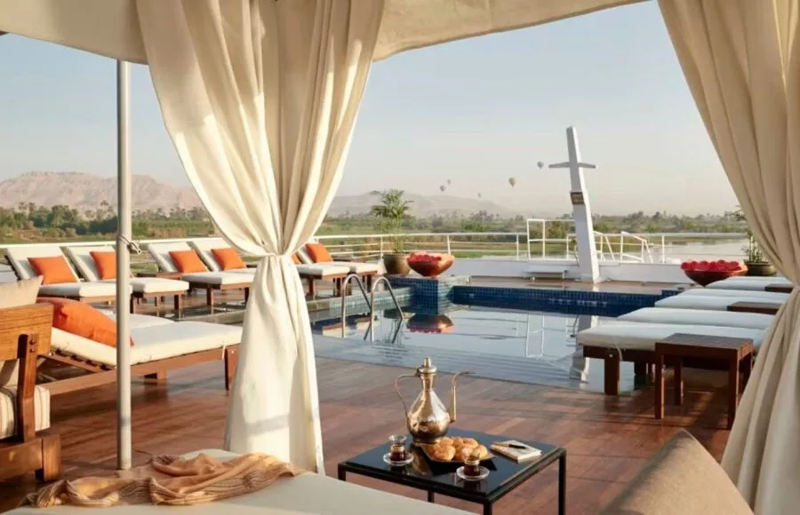 Sun deck and pool with white cabanas on the MS Sanctuary Nile Adventurer.