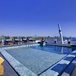 Clear swimming pool and sun loungers on the deck of the MS Sanctuary Nile Adventurer.