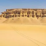 Sand-Below-Eroded-Cliffs-Wadi-Al-Hitan