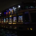 The Scarabee Nile Cruise boat beautifully illuminated on the river at night.