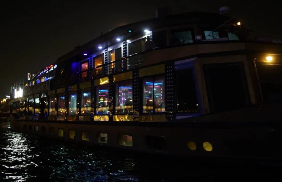 The Scarabee Nile Cruise boat beautifully illuminated on the river at night.