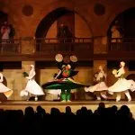 Performers in white robes dancing the Tanoura at Wekalet El Ghouri.