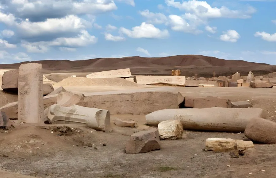 Broken, colossal stone ruins and inscribed blocks scatter the desert landscape at the ancient Egyptian site of Tanis (San el-Hagar).
